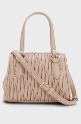 Faux-leather handbag with heart charm, light pink