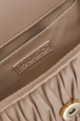 Faux-leather handbag with heart charm, light pink