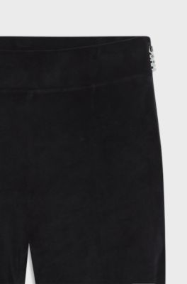 Stretch-velvet flared-fit trousers with front slits, Black