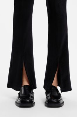 Stretch-velvet flared-fit trousers with front slits, Black