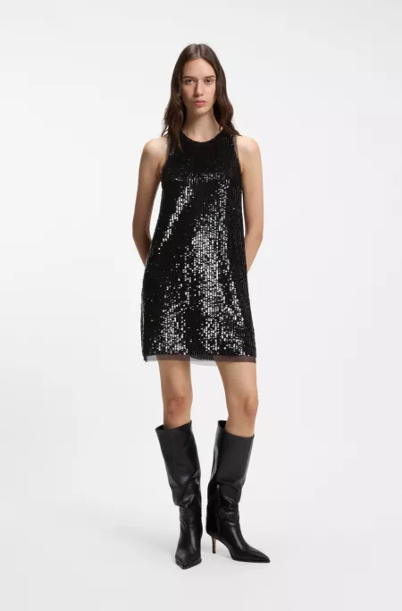 Sequin-covered mini dress with sheer trims
