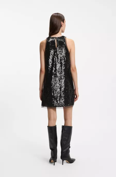 Sequin-covered mini dress with sheer trims