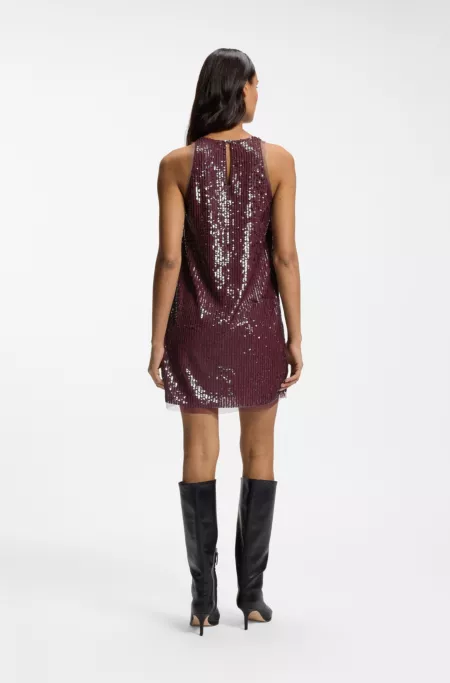 Sequin-covered mini dress with sheer trims