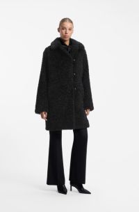 Manteau Relaxed en fourrure synth&eacute;tique textur&eacute;e, Noir