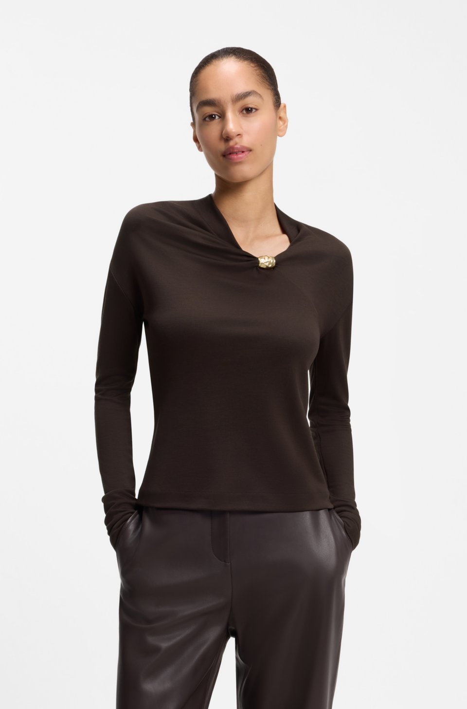 V-neck top with metallic neckline hardware