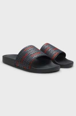 Italian-made slides with repeat-logo print, Black