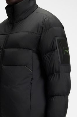Water-repellent puffer jacket with zipped sleeve pocket, Black