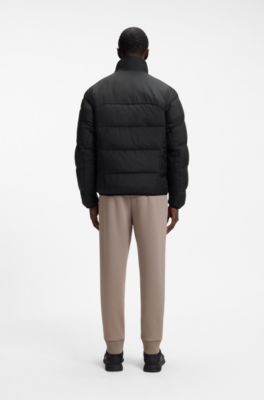 Water-repellent puffer jacket with zipped sleeve pocket, Black