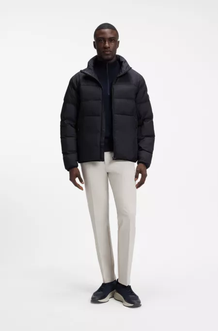 Water-repellent puffer jacket with zipped sleeve pocket