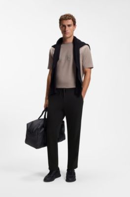 Regular-fit tracksuit bottoms with four-way stretch, Black