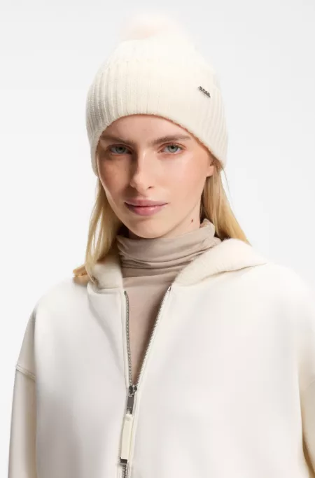 Beanie hat in ribbed virgin wool with pompom