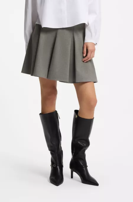 Jupe courte à la coupe évasée en tissu stretch chiné avec godets