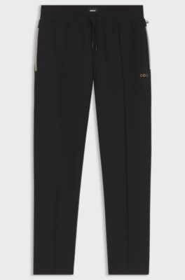 Interlock-cotton-blend tracksuit bottoms with metallic logo, Black