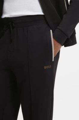 Interlock-cotton-blend tracksuit bottoms with metallic logo, Black