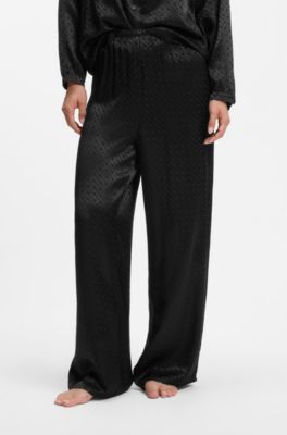 Pyjama trousers in satin with all-over monogram pattern, Black