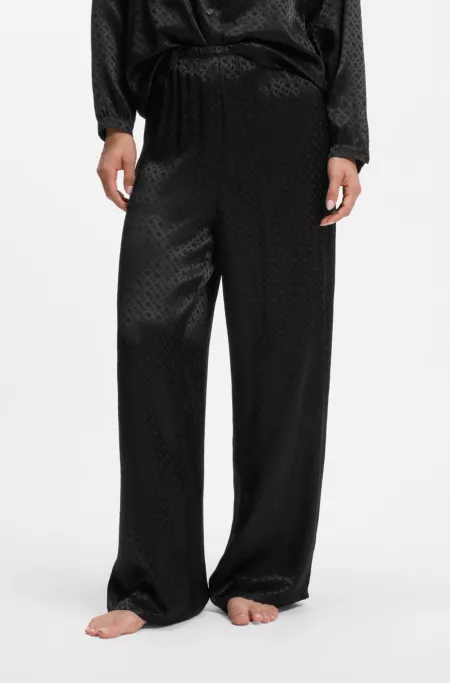 Pyjama trousers in satin with all-over monogram pattern
