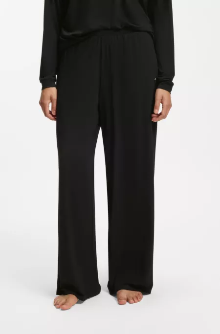 Pyjama bottoms with lace-trimmed pockets