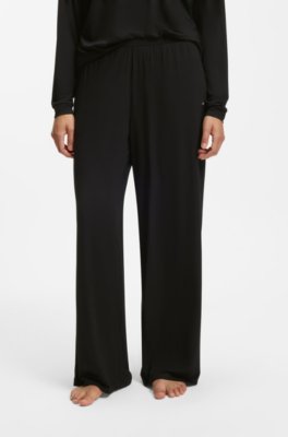 Pyjama bottoms with lace-trimmed pockets