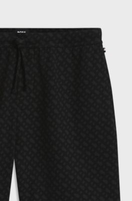 Pantalones de pijama de mezcla de algod&oacute;n con estampado gr&aacute;fico, Negro