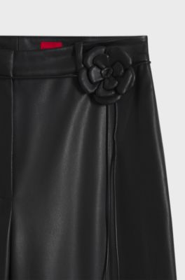 Wide-leg trousers in faux leather with floral embellishment, Black