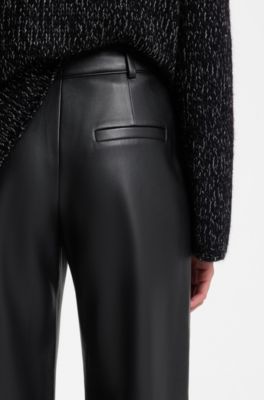 Wide-leg trousers in faux leather with floral embellishment, Black