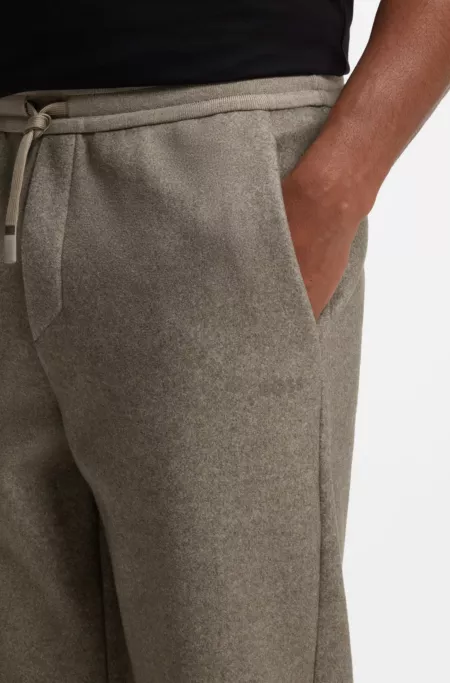 Regular-fit trousers in melange fabric with logo