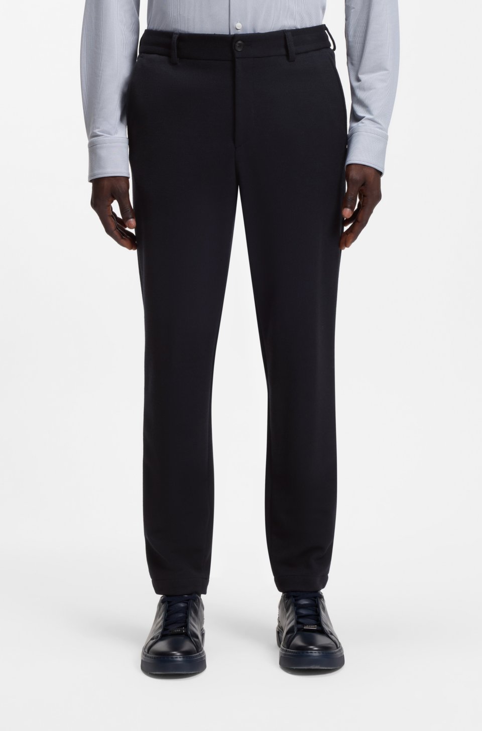 Tapered-fit trousers in micro-patterned stretch jersey
