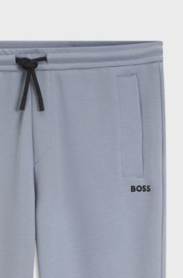 Piqu&eacute; casual trousers with tennis-inspired details, Grey