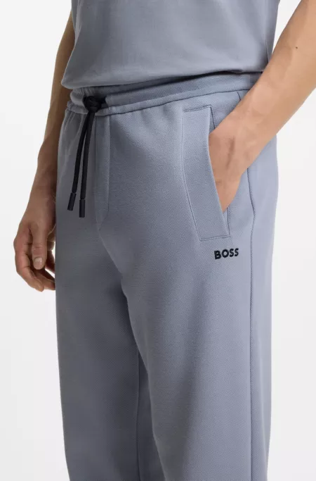 Piqué casual trousers with tennis-inspired details