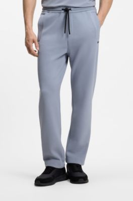 Piqu&eacute; casual trousers with tennis-inspired details, Grey