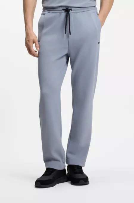 Piqué casual trousers with tennis-inspired details