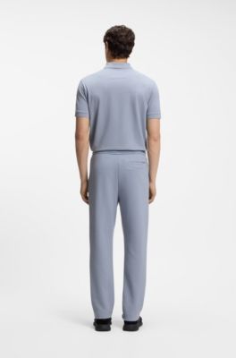 Piqu&eacute; casual trousers with tennis-inspired details, Grey