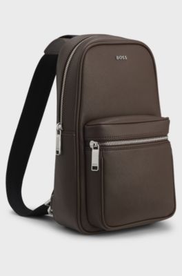 Sleek faux-leather backpack with metal branding, Dark Brown