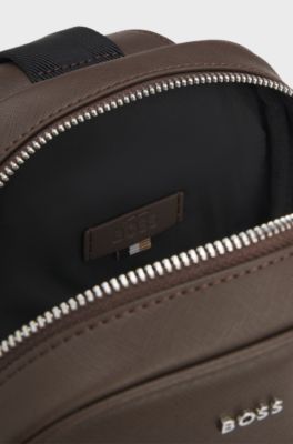 Sleek faux-leather backpack with metal branding, Dark Brown