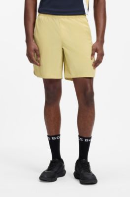 Performance tennis shorts with colour-block details, Yellow