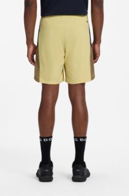 Performance tennis shorts with colour-block details, Yellow