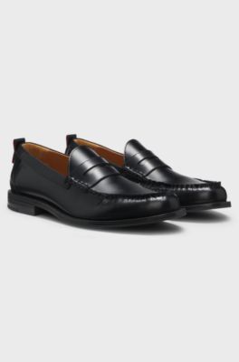 Penny loafers in brush-off leather, Black