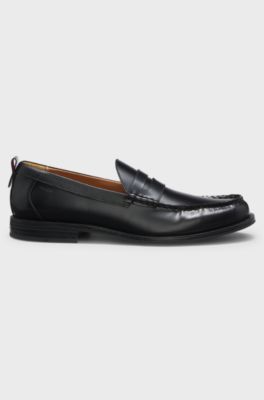 Penny loafers in brush-off leather, Black