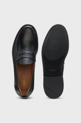 Penny loafers in brush-off leather, Black