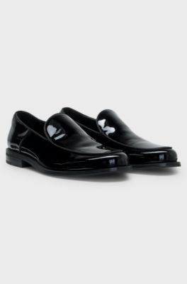 Patent-leather slip-on loafers with embossed logo, Black