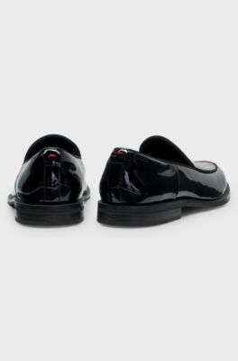 Patent-leather slip-on loafers with embossed logo, Black