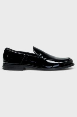 Patent-leather slip-on loafers with embossed logo, Black