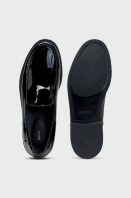 Patent-leather slip-on loafers with embossed logo, Black