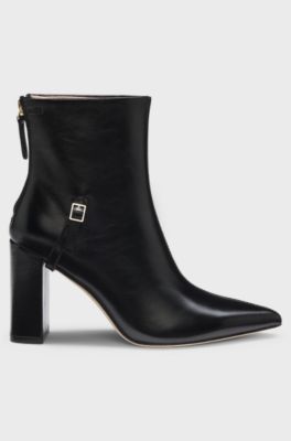 Pointed-toe boots in glossy leather with buckle detail, Black