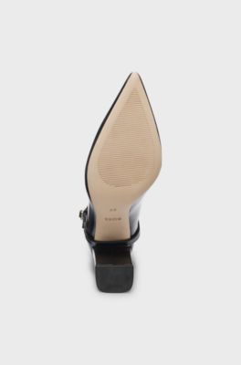 Pointed-toe boots in glossy leather with buckle detail, Black