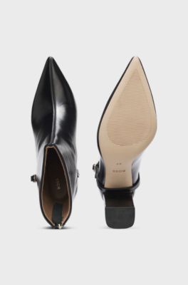 Pointed-toe boots in glossy leather with buckle detail, Black