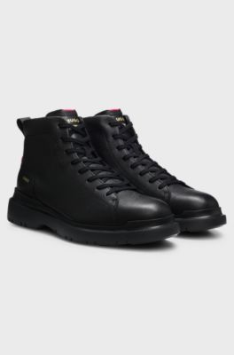 Grainy leather boots with embossed logo, Black