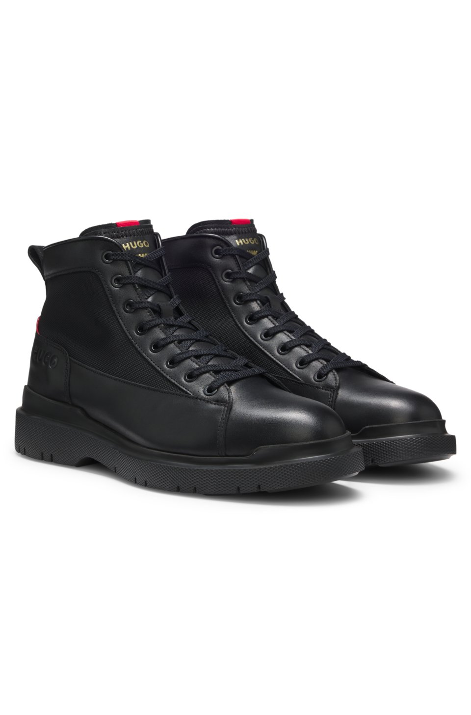 Half boots in leather with textured panels