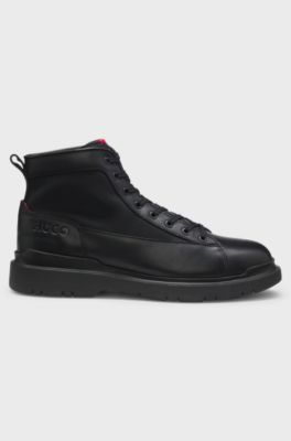 Half boots in leather with textured panels, Black