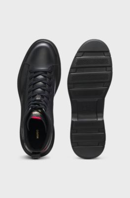 Half boots in leather with textured panels, Black